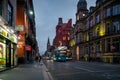 City view of Liverpool streets with blurred double decker buses Royalty Free Stock Photo