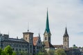City view of old downtown at the bank of Limmat River of Zurich city, with beautiful house, and Church of  Fraumunster Royalty Free Stock Photo