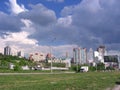 City view with roads and modern buildings in a city with storm clouds in summer