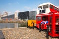 City views of the historic Canning Dock with a traditional bus & telephone box on the River Mersey, Liverpool, England, UK. Royalty Free Stock Photo