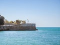 City walls with the bastion Baluarte de la Candelaria and the park of Alameda Apodaca in the Old Town of Cadiz, Spain