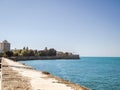 City walls with the bastion Baluarte de la Candelaria and the park of Alameda Apodaca in the Old Town of Cadiz, Spain