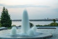 City water fountain in the evening close-up. A rushing stream of water pours. Royalty Free Stock Photo