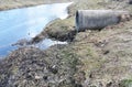 City water gushing from the sewer. Water pollution.