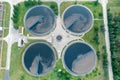 City water purification. Wastewater flows through large circular tanks with power-driven scrapers. View from above