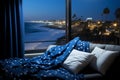City waves: Dark blue sofa and a magical view of the city and the sea Royalty Free Stock Photo