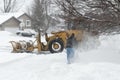 City Worker And Homeowner Clearing Snow