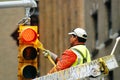 City Worker Painting a traffic light