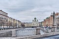 Citycape of St. Petersburg, Russia. View of Griboyedov canal, embankment and St. Isidor's Church.