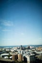 Cityscape against blue sky on sunny day Royalty Free Stock Photo