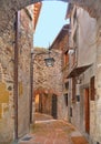 Cityscape with arch on the narrow street in old historic alley in the medieval village of Anghiari near city of Arezzo in Tuscany,