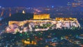 Cityscape of Athens with illuminated Acropolis hill, Pathenon and Herodium construction and sea at night. Athens skyline at night Royalty Free Stock Photo