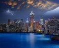 Cityscape in Bangkok city from roof top bar in hotel with swimming pool Royalty Free Stock Photo