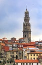 Baroque Torre dos Clerigos church bell tower viewed over the terracotta roofs of the old town of Porto, Portugal Royalty Free Stock Photo