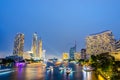 Cityscape of boat light trails on Chao Phraya River night scene in Bangkok, Thailand