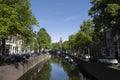 Cityscape of a canal with monumental buildings. Gouda, the Netherlands