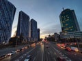 Cityscape with car traffic on a road with three lanes of traffic in the evening city. Kyiv, Ukraine Royalty Free Stock Photo