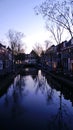 Delft, Netherlands, April 2011: cityscape of a canal in downtown