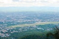 Cityscape of Chiang Mai city,Thailand and airport view. View point at Wat Phra That Doi Suthep Royalty Free Stock Photo