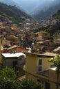 Cityscape of Cinque Terre village roofs with traditional houses coast with hazy sky