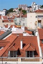 Cityscape of colorful traditional houses in Lisbon historic center, Portuguese red rooftops, balconies, antenna, Royalty Free Stock Photo