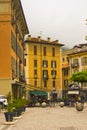 Cityscape of decorated faÃ§ade with wood green shutters Como Italy