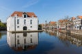 Cityscape of Delft with historic houses and army museum, the Netherlands Royalty Free Stock Photo