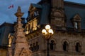 Cityscape of downtown Ottawa, Canada at night with street lights and historic government buildings. Royalty Free Stock Photo