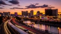 Cityscape at Dusk with Train Light Trails River and Casino Lights Royalty Free Stock Photo