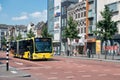 Cityscape Dutch city Utrecht with urban bus waiting for crossway