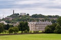 Cityscape of Edinbugrh, Scotland, Great Britain with famous Holyrood House royal residence, Calton Hill and industrial cranes Royalty Free Stock Photo