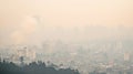 Cityscape engulfed in heavy smog haze
