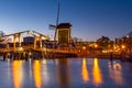 Cityscape - evening view of the city canal with drawbridge and windmill, the city of Leiden