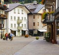 Cityscape of FaÃ§ade and flowers and balconies, in Cortina dAmpezzo, Province of Belluno, Italy Royalty Free Stock Photo