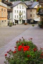 Cityscape of FaÃ§ade and flowers and balconies, in Cortina dAmpezzo, Province of Belluno, Italy Royalty Free Stock Photo