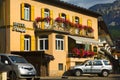 Cityscape of FaÃ§ade and flowers on balconies, in Cortina dAmpezzo, Province of Belluno, Italy