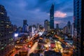 Cityscape of the famous Maha Nakhon Tower in Bangkok, Thailand. Light trails in the streets from the cars.