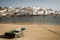 Cityscape of Ferragudo with a traditional wooden fishing boat on the beach in the foreground, Algarve, Portugal Royalty Free Stock Photo