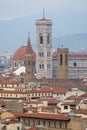 Cityscape of Florence on a cloudy day with the bell tower of the Basilica di Santa Maria del Fiore of Florence, Italy.