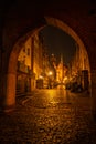 Cityscape of Gdansk with St. Mary Basilica and City Hall at night, Poland. Beautiful architecture of Mariacka street Royalty Free Stock Photo