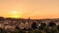 Cityscape at gold sunset on Rome. Saint Peter Dome silhouette on horizon. Timelapse landscape