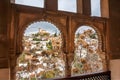 Cityscape of Granada from window of historical house in traditional architecture style of Andalusia region, Spain