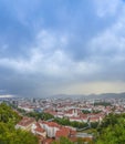 Cityscape of Graz with Mariahilfer church and historic and modern buildings of Graz, Styria region, Austria, at sunset. Dramatic