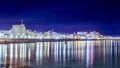 Cityscape with illuminated beach and shimmering water in Mdiq, Morocco