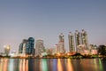 Cityscape image of Benjakitti Park at sunset time with reflection in Bangkok, Thailand, Cityscape image of Benchakiti Park,