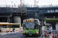 Cityscape and japanese people drive bus on traffic road and stop