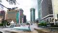 Cityscape of Kuala Lumpur. A beautiful white mosque among modern buildings. Multi cultural city of Asia