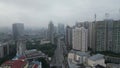 Cityscape of Kuala Lumpur enshrouded in fog.