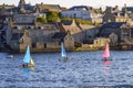 Cityscape in Lerwick with colorful sailboats in the water