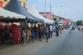 Cityscape of Local African Cape Coast town with Ghana People and Cars on the street